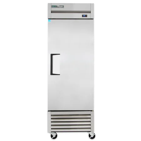 Front View Of A True T-23F-Hc Commercial Reach-In Freezer Made Of Stainless Steel. The Unit Features A Single Solid Door With A Black Recessed Handle, A Top-Mounted Digital Temperature Readout Displaying -10 Degrees, And A Louvered Bottom Grill. It Is Mounted On Four Swivel Wheels Against A White Background.