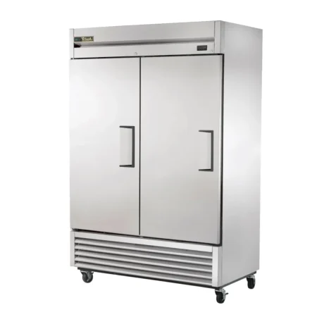 A Two-Door, Stainless Steel True Commercial Reach-In Refrigerator With A Bottom-Mounted Compressor, Digital Temperature Display, And Heavy-Duty Casters On A White Background.