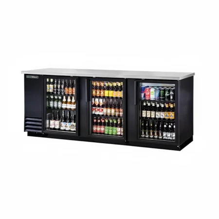 A wide, black commercial-grade back bar refrigerator featuring three glass swing doors, a stainless steel countertop, and multiple shelves stocked with various bottled and canned beverages.