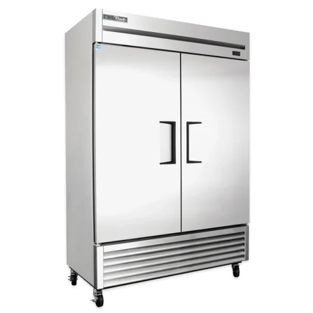 A Front-Angle View Of A True Manufacturing Ts-49 Commercial Reach-In Refrigerator Featuring A Stainless Steel Exterior, Two Solid Doors With Recessed Handles, A Bottom-Mounted Compressor Unit, And Heavy-Duty Casters For Mobility.