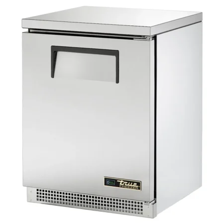 A front-angled view of a single-door True TUC-24F-HC stainless steel compact undercounter freezer featuring a recessed handle and a front-venting louvered base.
