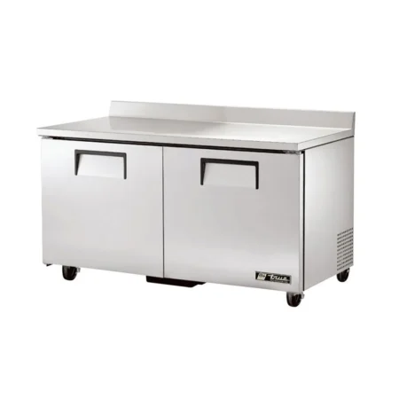A two-door True stainless steel worktop refrigerator with a 60-inch wide work surface, integrated rear backsplash, recessed handles, and heavy-duty swivel casters.